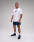 Man wearing a white t-shirt with a 'USA Wrestling' logo and navy shorts on a plain background