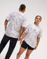 Male and female models wearing the USA Wrestling Map Classic Cotton T-Shirt in tree camo, featuring a gray wrestling graphic over a USA map outline on the front and A WAY OF LIFE lettering across the back.