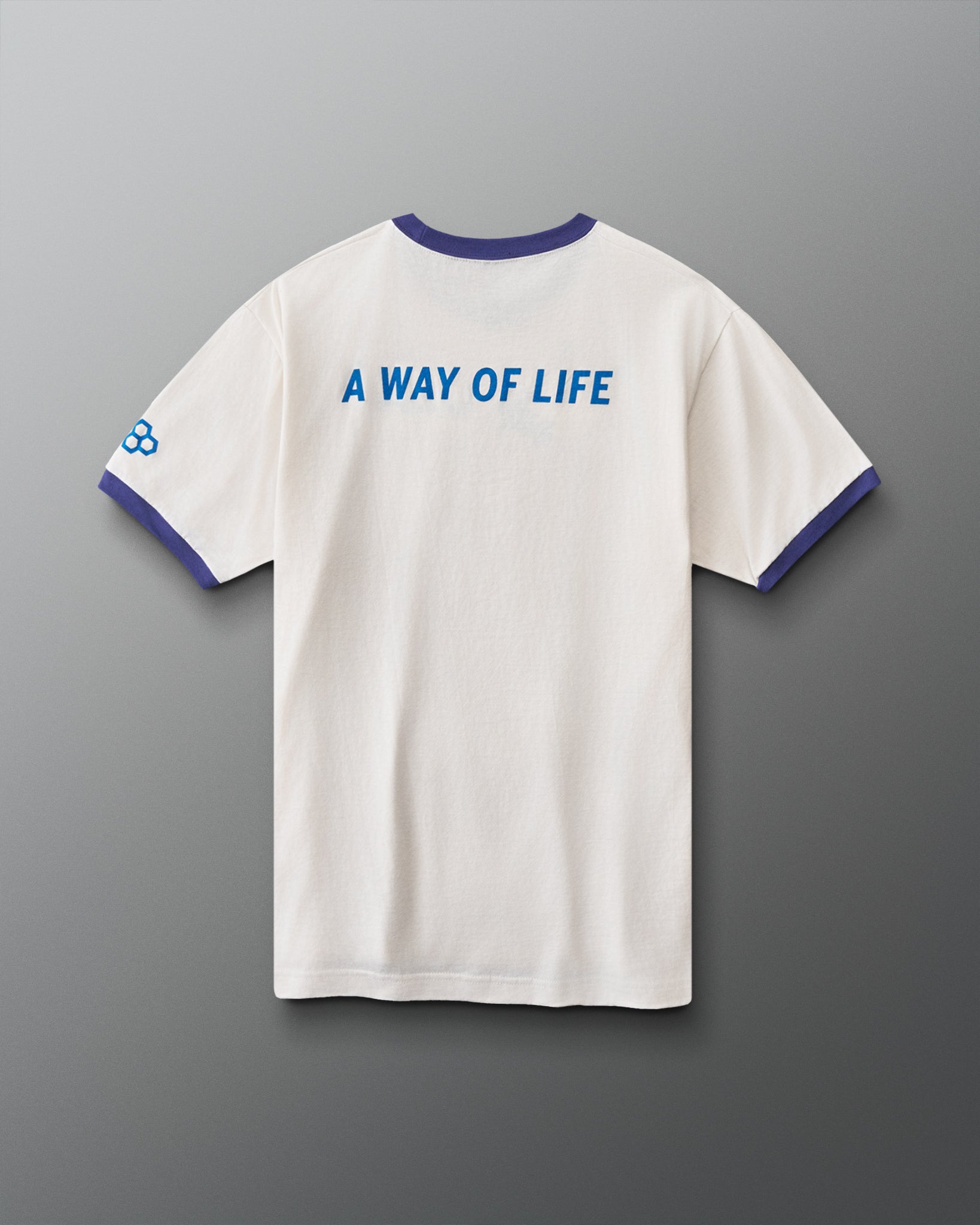 Back view of RUDIS USA Wrestling Ringer T-Shirt in vintage white with navy trim, blue “A Way of Life” graphic, and RUDIS sleeve logo.