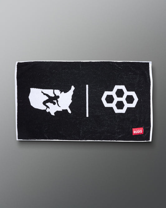 USA Wrestling Black towel with white graphics and a red logo on a gray background