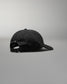 Black cap on a gray background