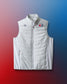 White vest with logos on a gradient red to blue background