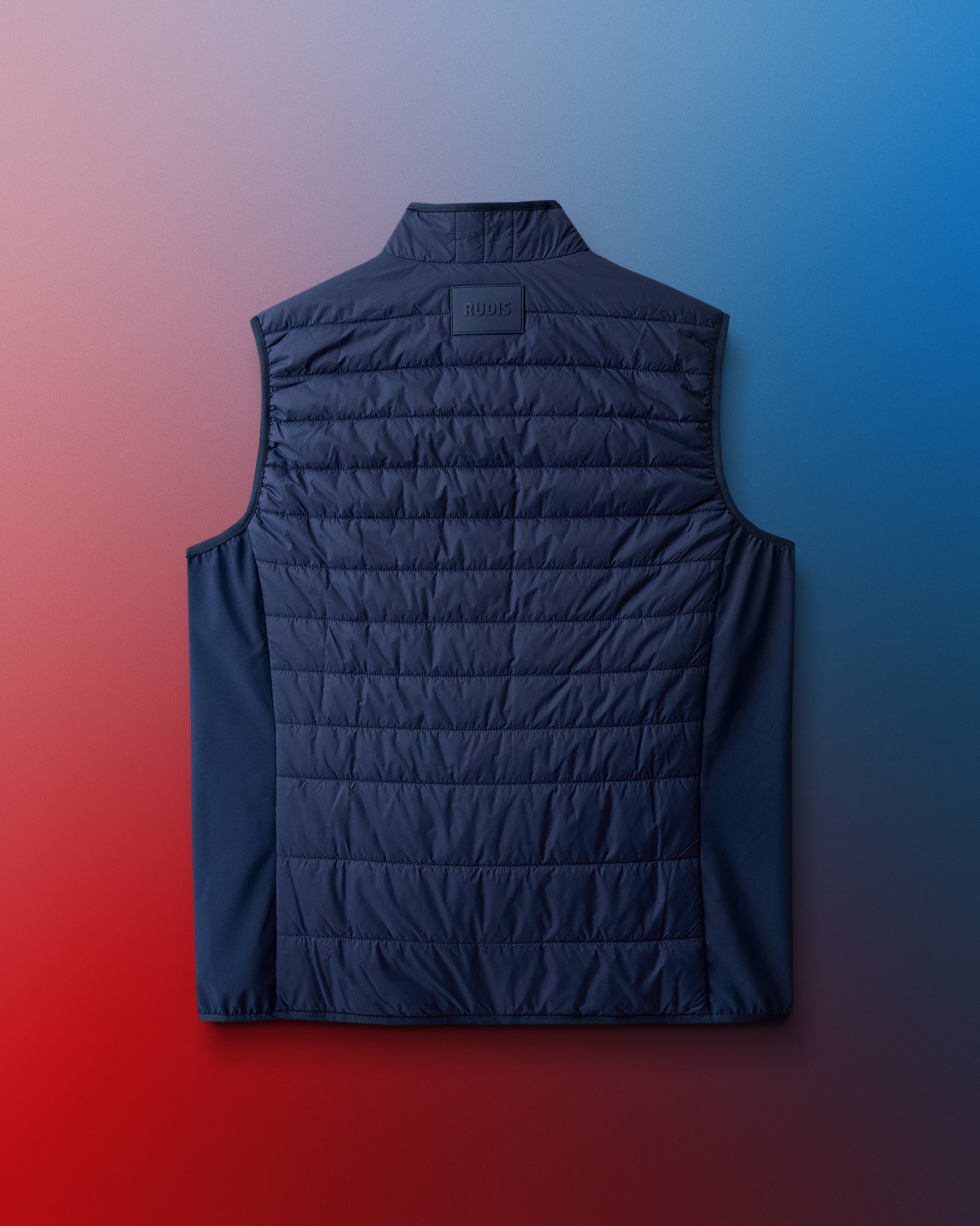 Black quilted vest on a gradient background