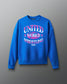 Royal blue RUDIS UWW Globe Relaxed Comfort Fleece Crewneck shown from the front, featuring a bold pink-and-white “UNITED WORLD WRESTLING” globe graphic across the chest with RUDIS branding below.