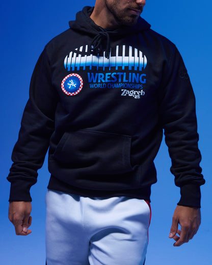 Person wearing a black hoodie with wrestling championship design on a blue background