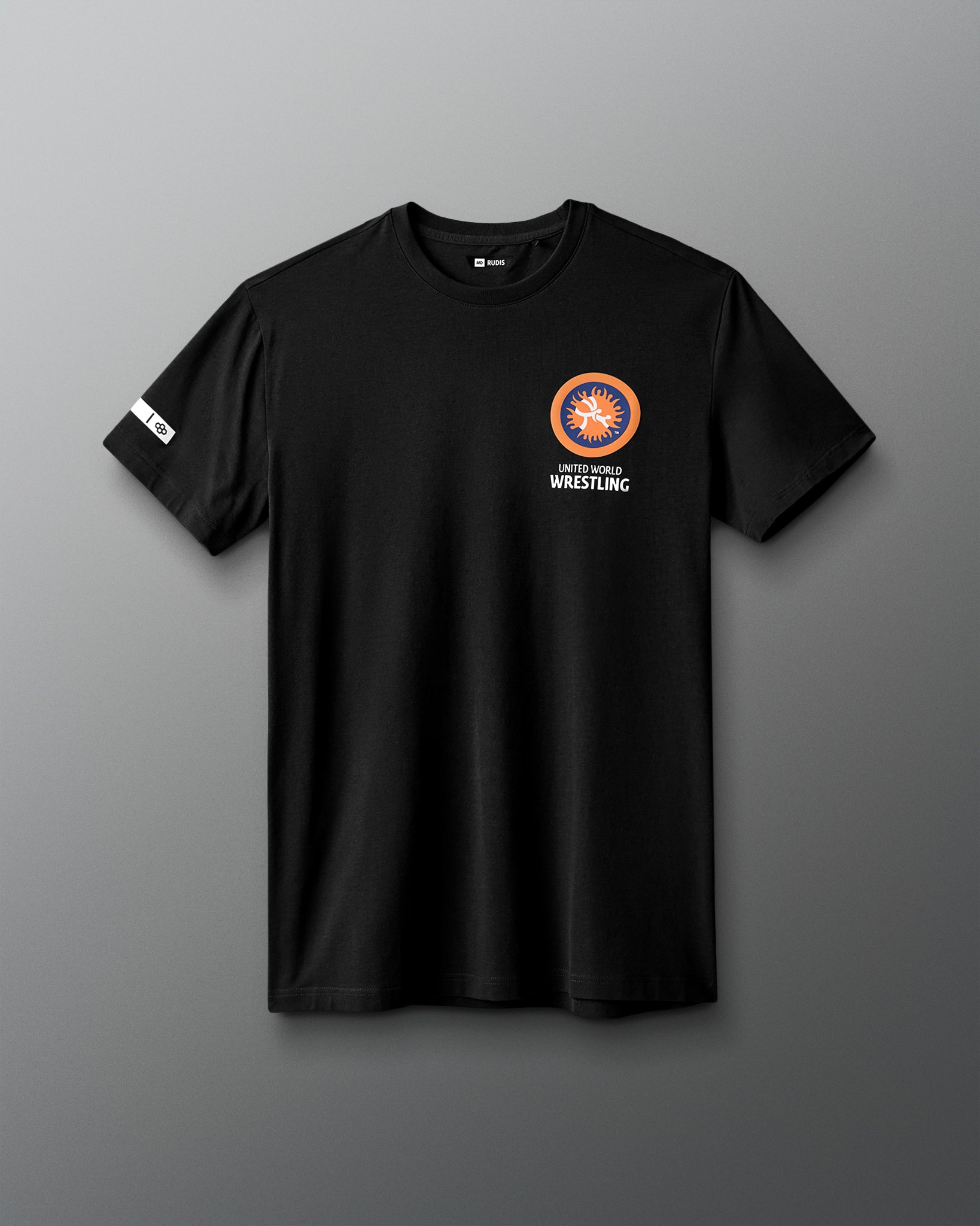 Black t-shirt with a logo and text on a gray background