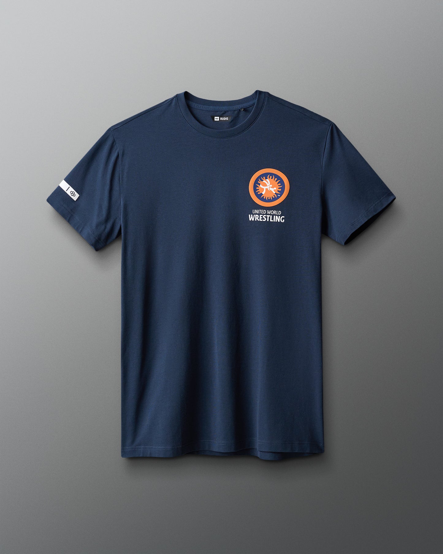 Navy blue t-shirt with a logo on the chest against a gray background