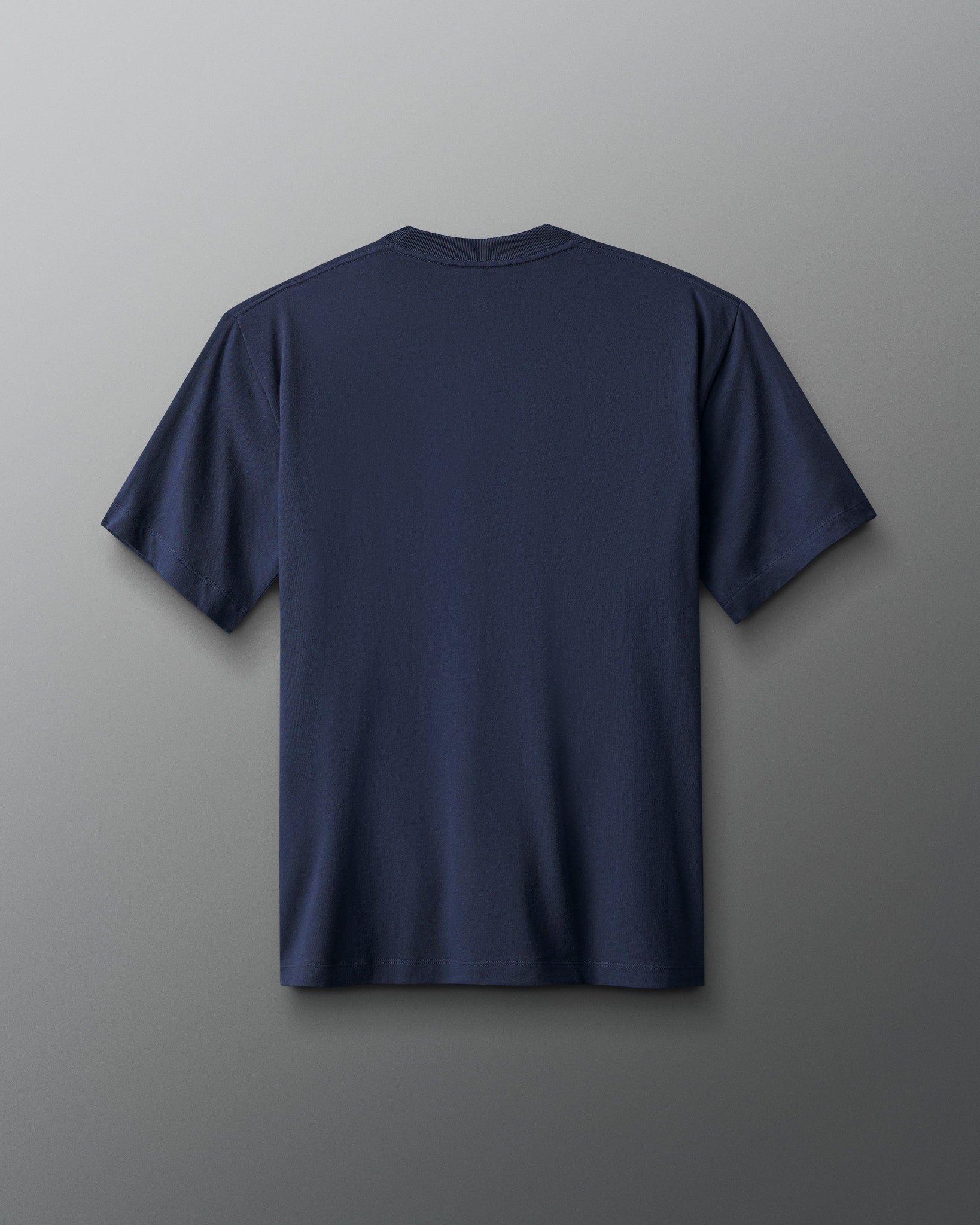 Navy blue t-shirt on a gray background