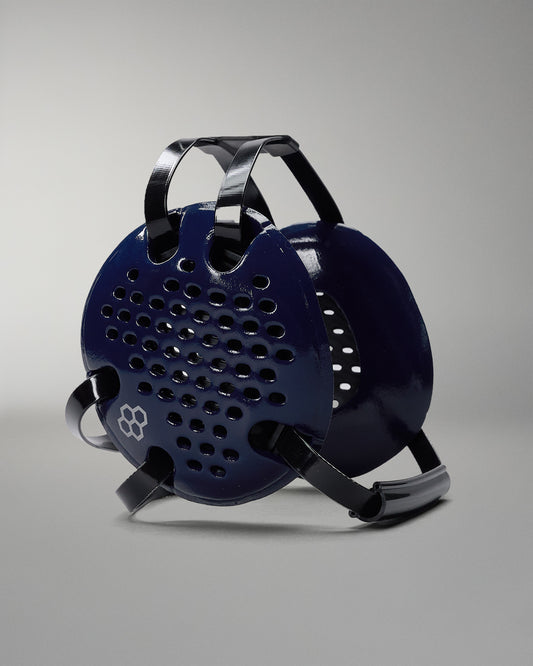 Blue and black grill on a gray background