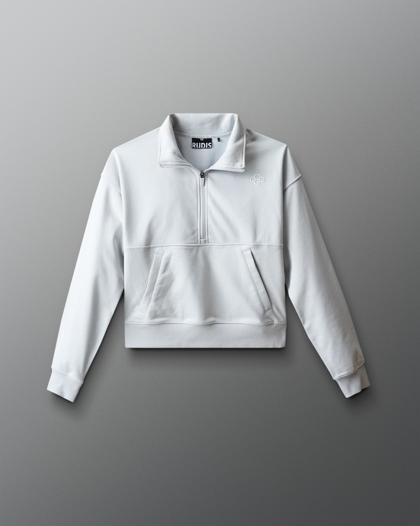 Light gray sweatshirt with a brand logo on a gray background