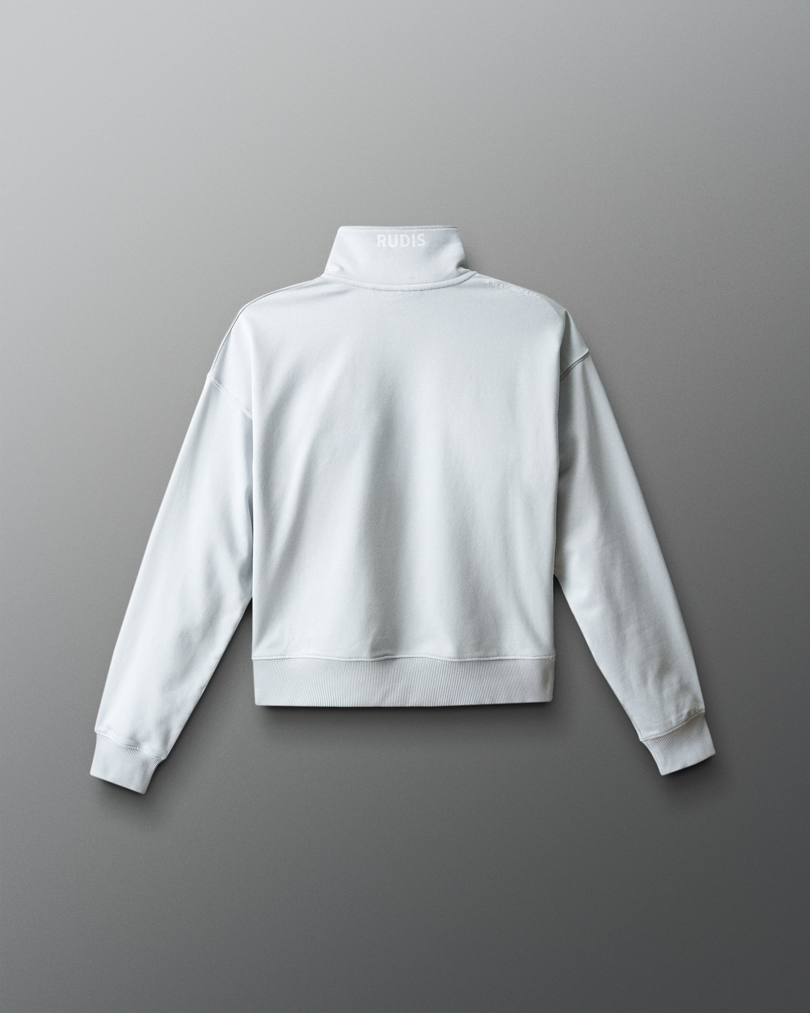 White sweatshirt on a gray background