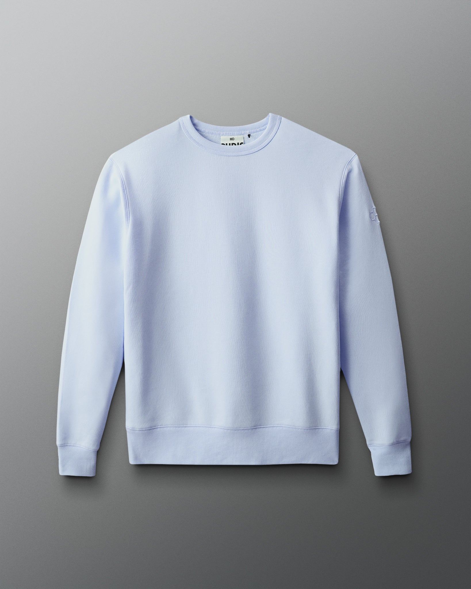 Light blue sweatshirt on a gray background