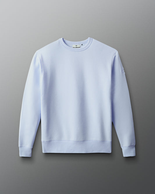Light blue sweatshirt on a gray background