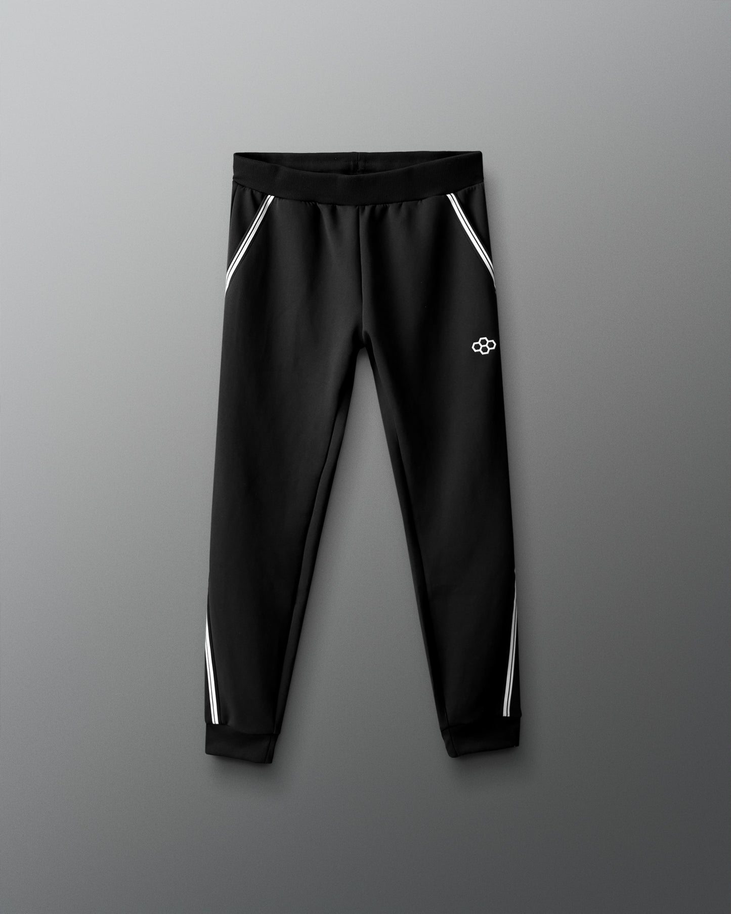 Black pants with white stripes on a gray background