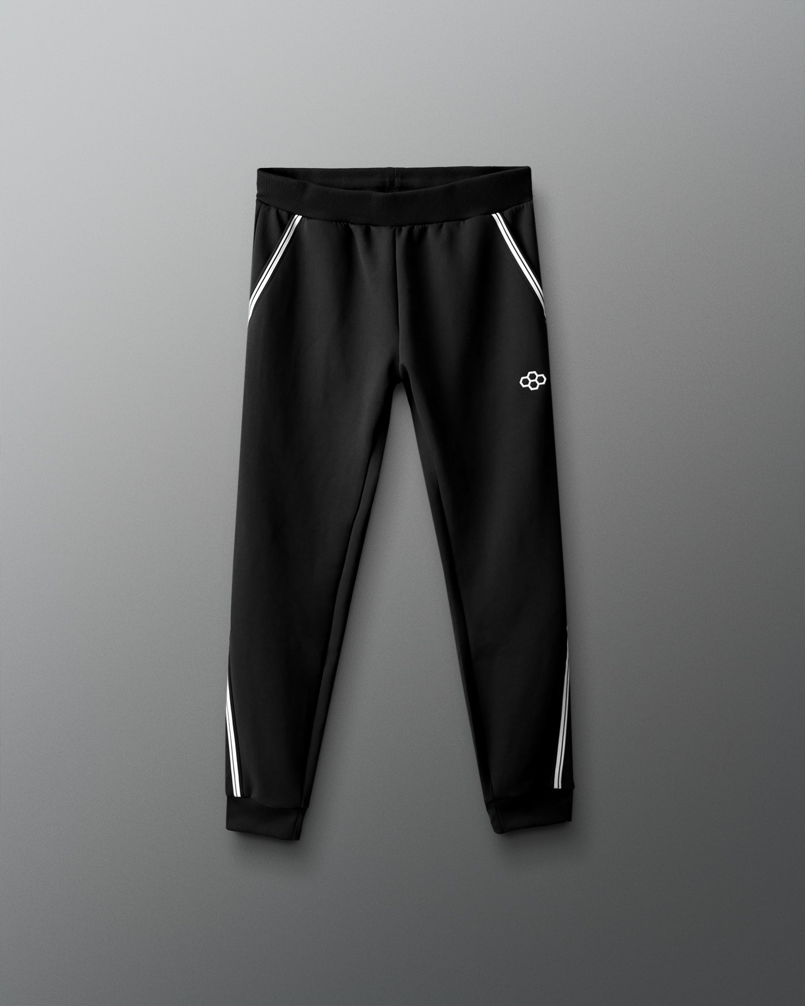 Black pants with white stripes on a gray background
