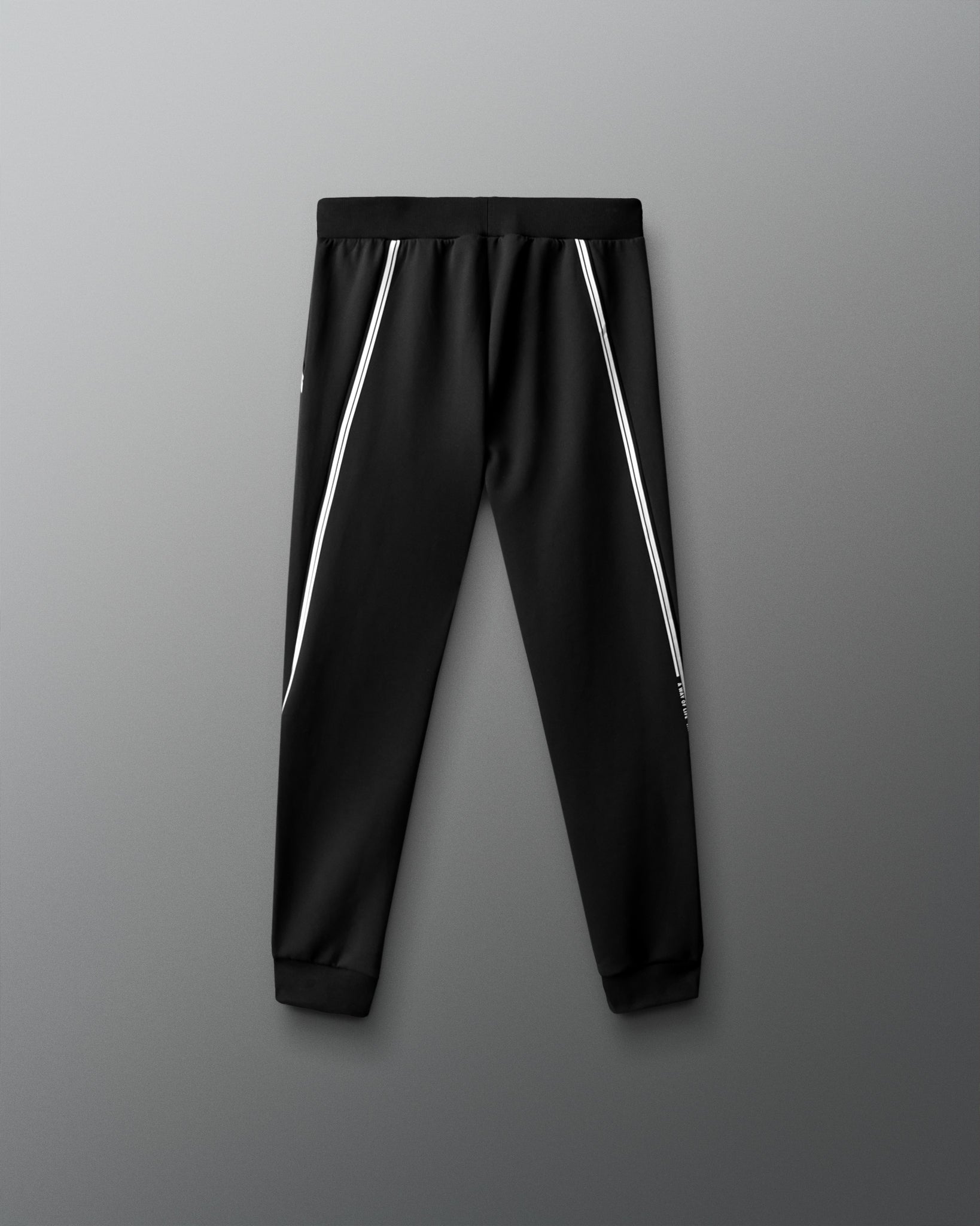 Black pants with white stripes on a gray background