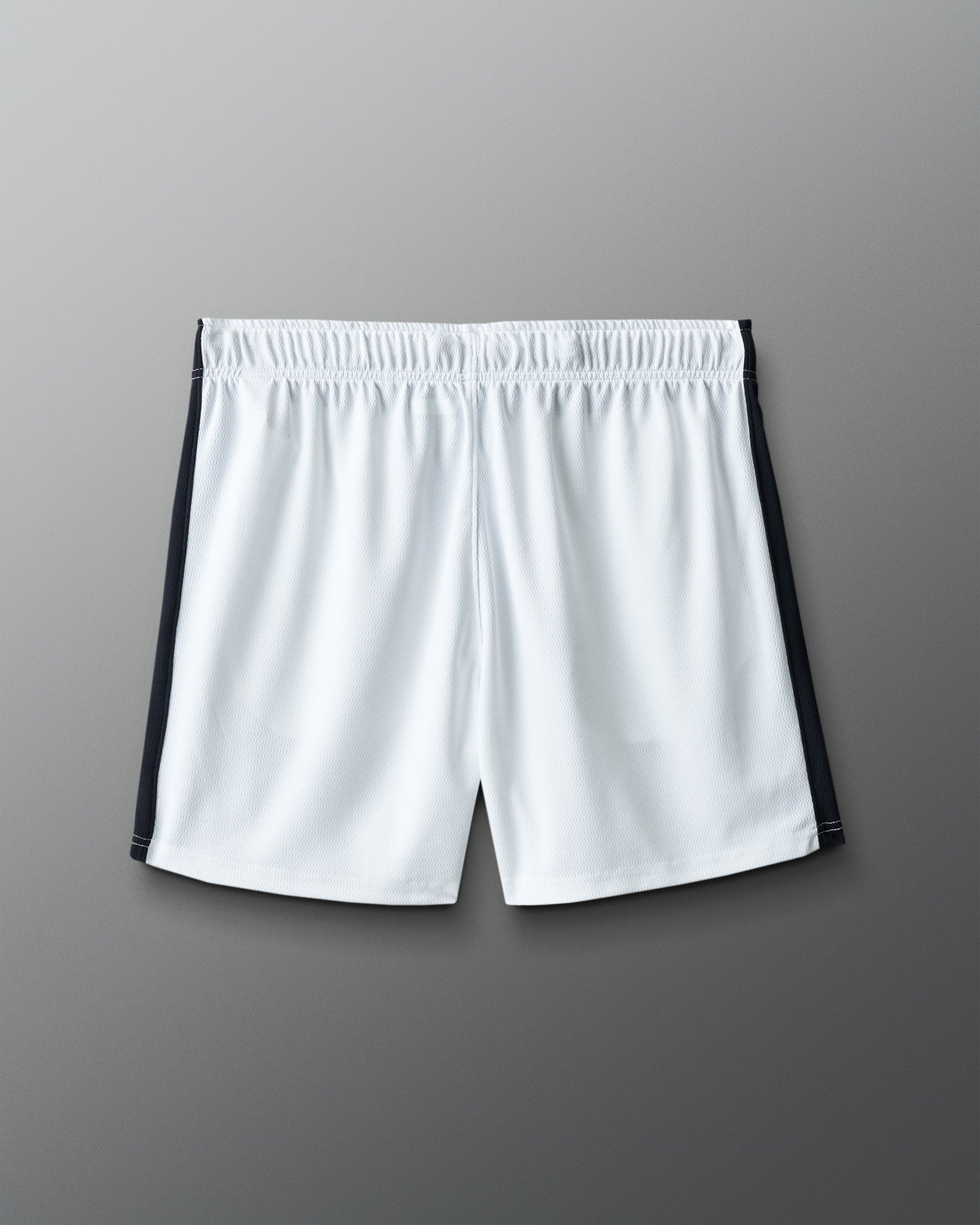 White shorts with black accents on a gray background