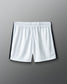 White shorts with black accents on a gray background