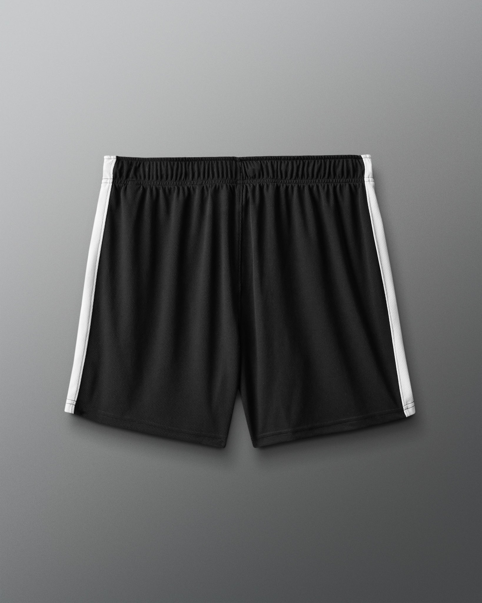 Black shorts with white stripes on a gray background