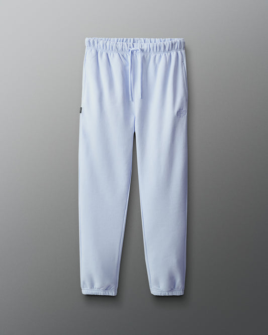 Light blue sweatpants on a gray background