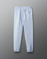 Light blue sweatpants on a gray background