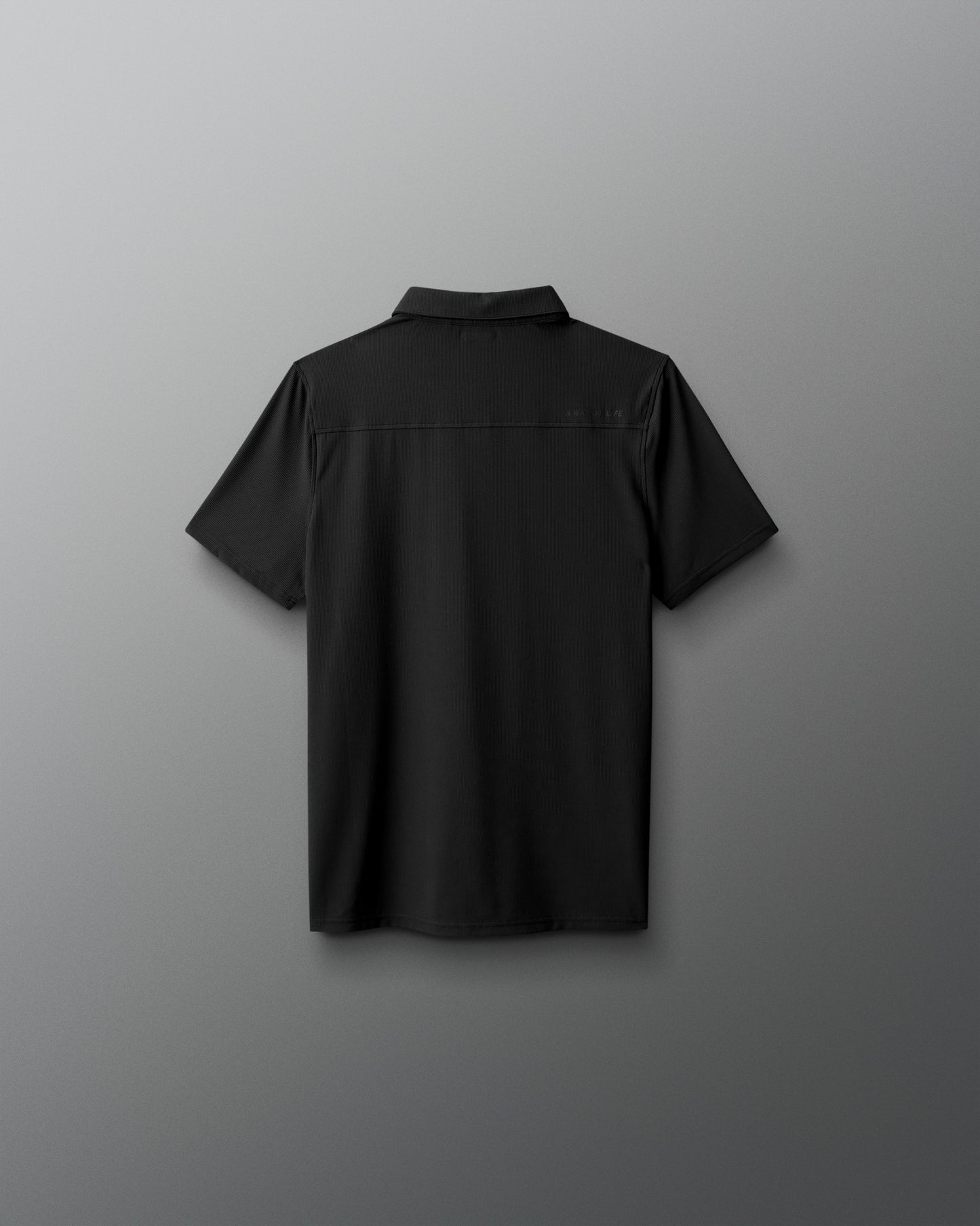 Black short-sleeve shirt on a gray background