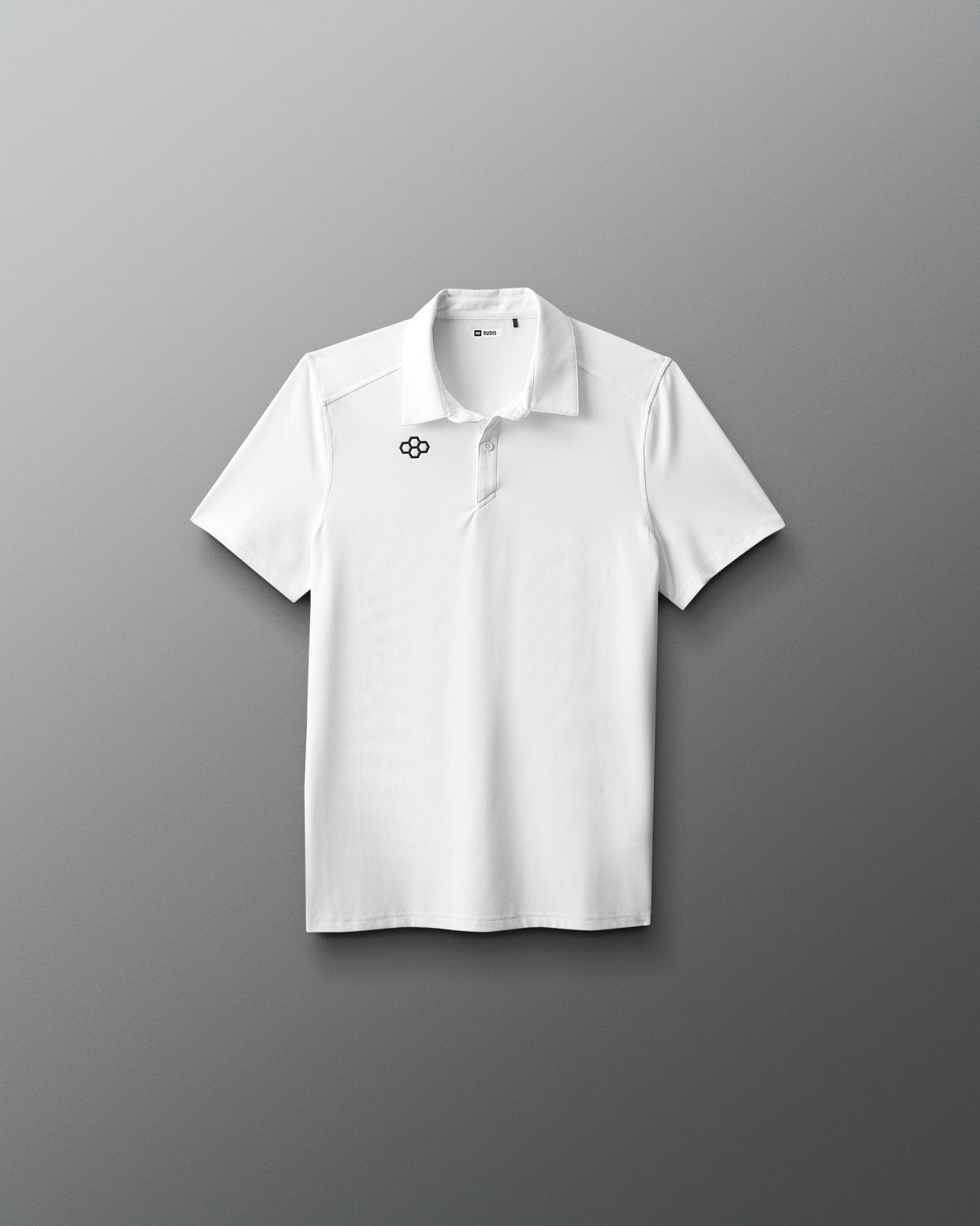 White polo shirt with a logo on a gray background