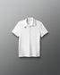 White polo shirt with a logo on a gray background