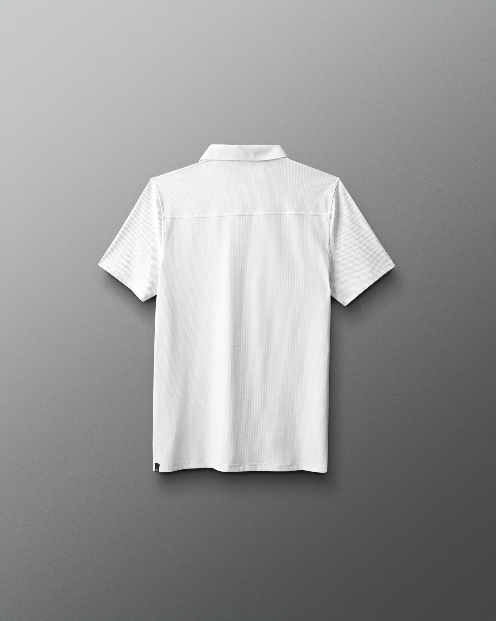 White polo shirt on a gray background