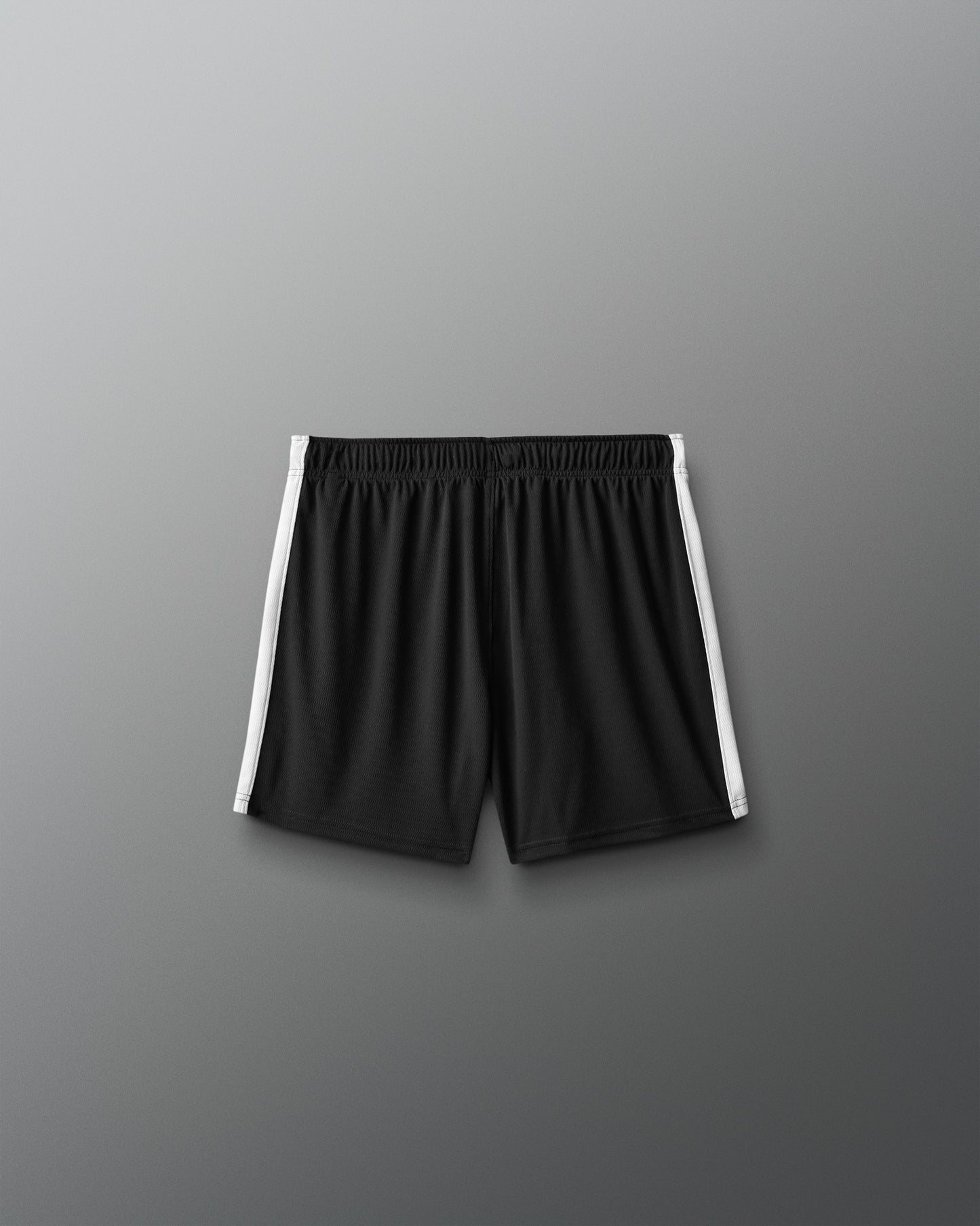 Black shorts with white stripes on a gray background