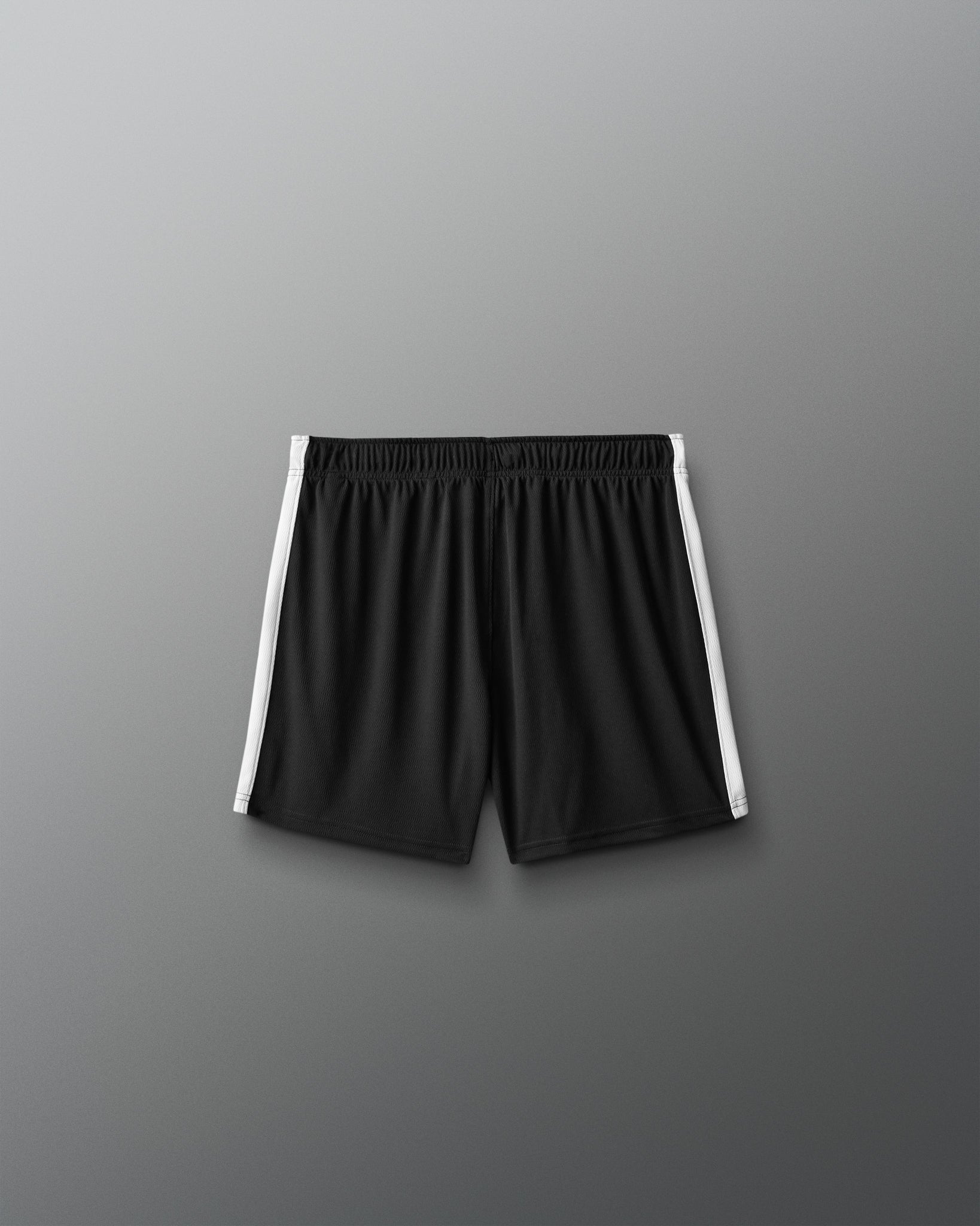 Black shorts with white stripes on a gray background