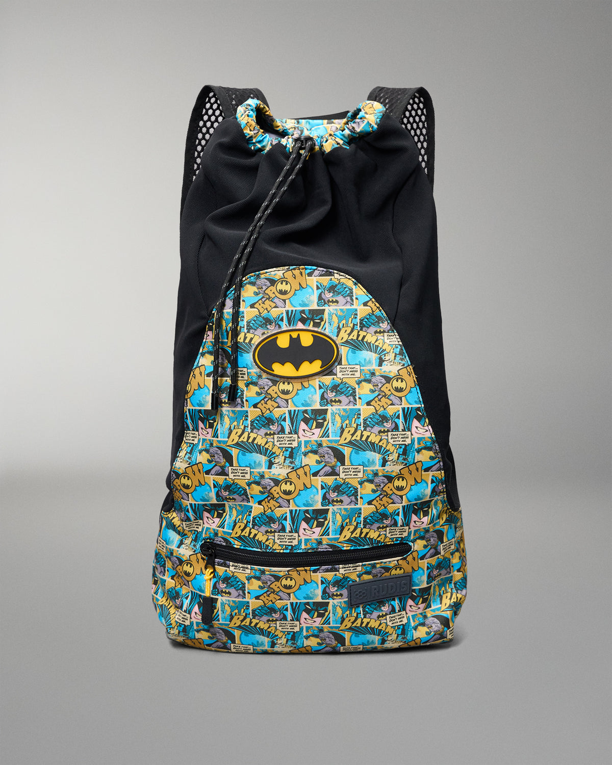 Front view of the RUDIS Batman Double Cinch wrestling backpack featuring an all-over Batman comic print, Batman logo, drawstring top, and zip pocket.
