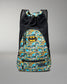 Front view of the RUDIS Batman Double Cinch wrestling backpack featuring an all-over Batman comic print, Batman logo, drawstring top, and zip pocket.
