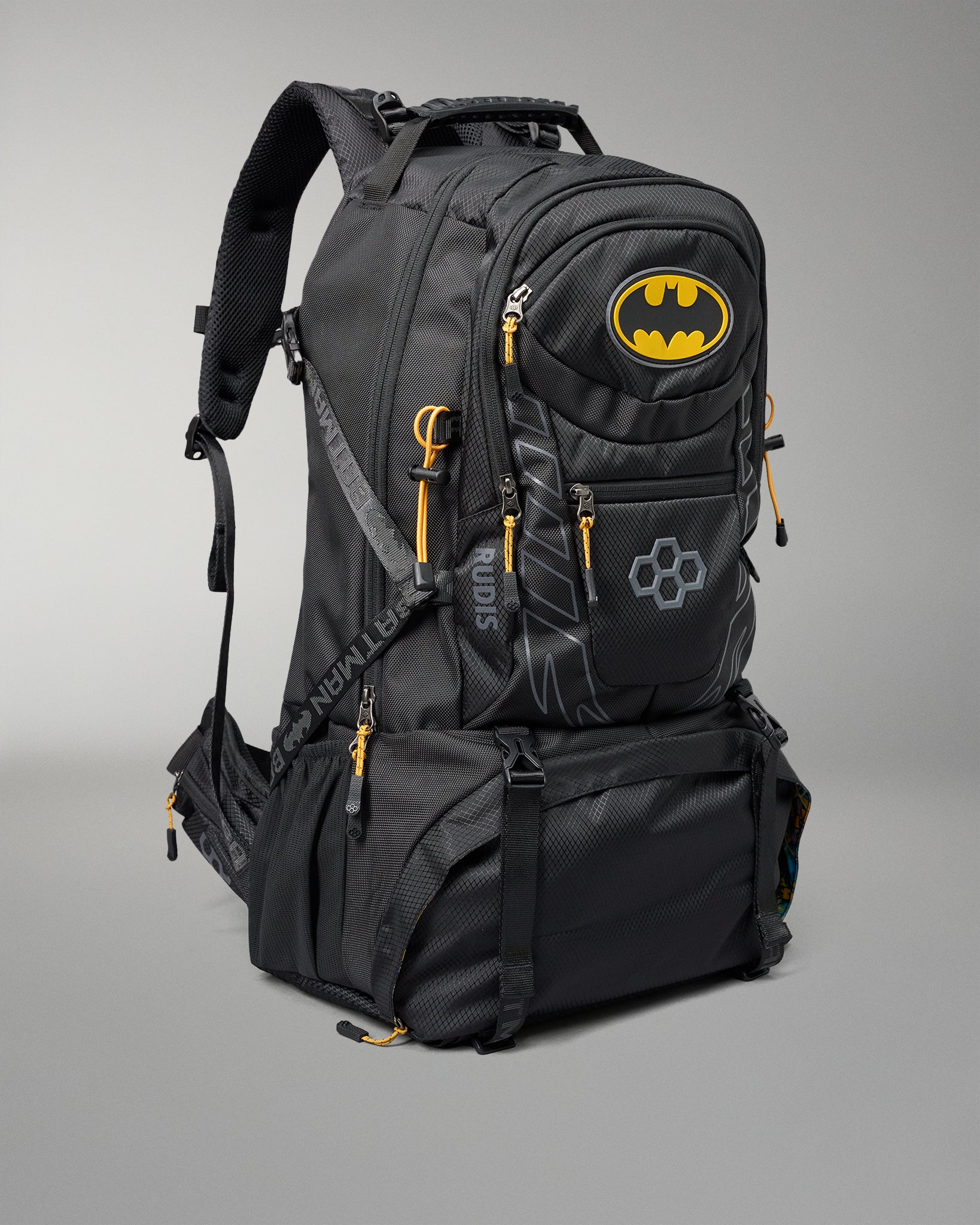 Black backpack with Batman logo on a gray background