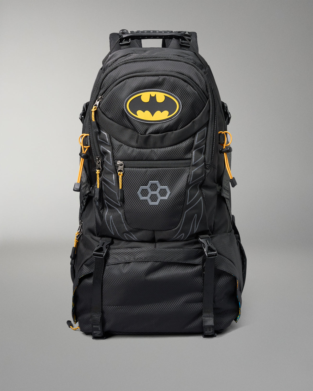 Black backpack with Batman logo on a gray background