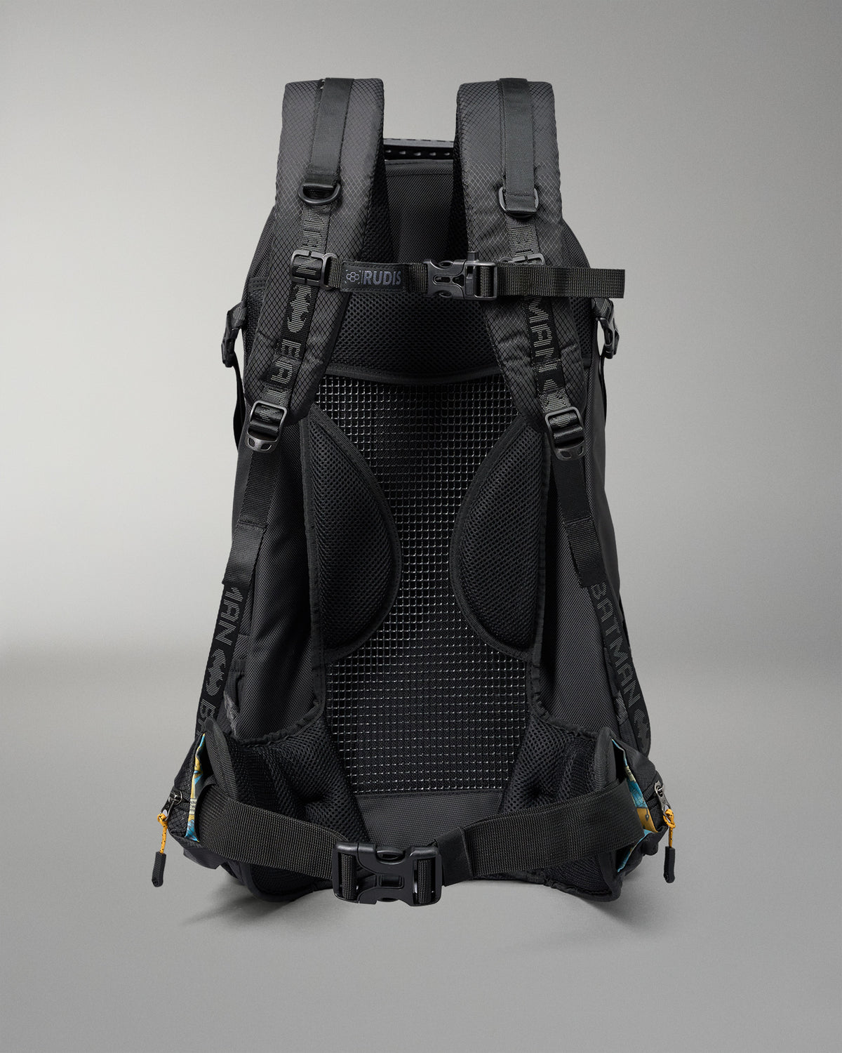 Black backpack with visible branding on a gray background
