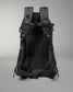 Black backpack with visible branding on a gray background