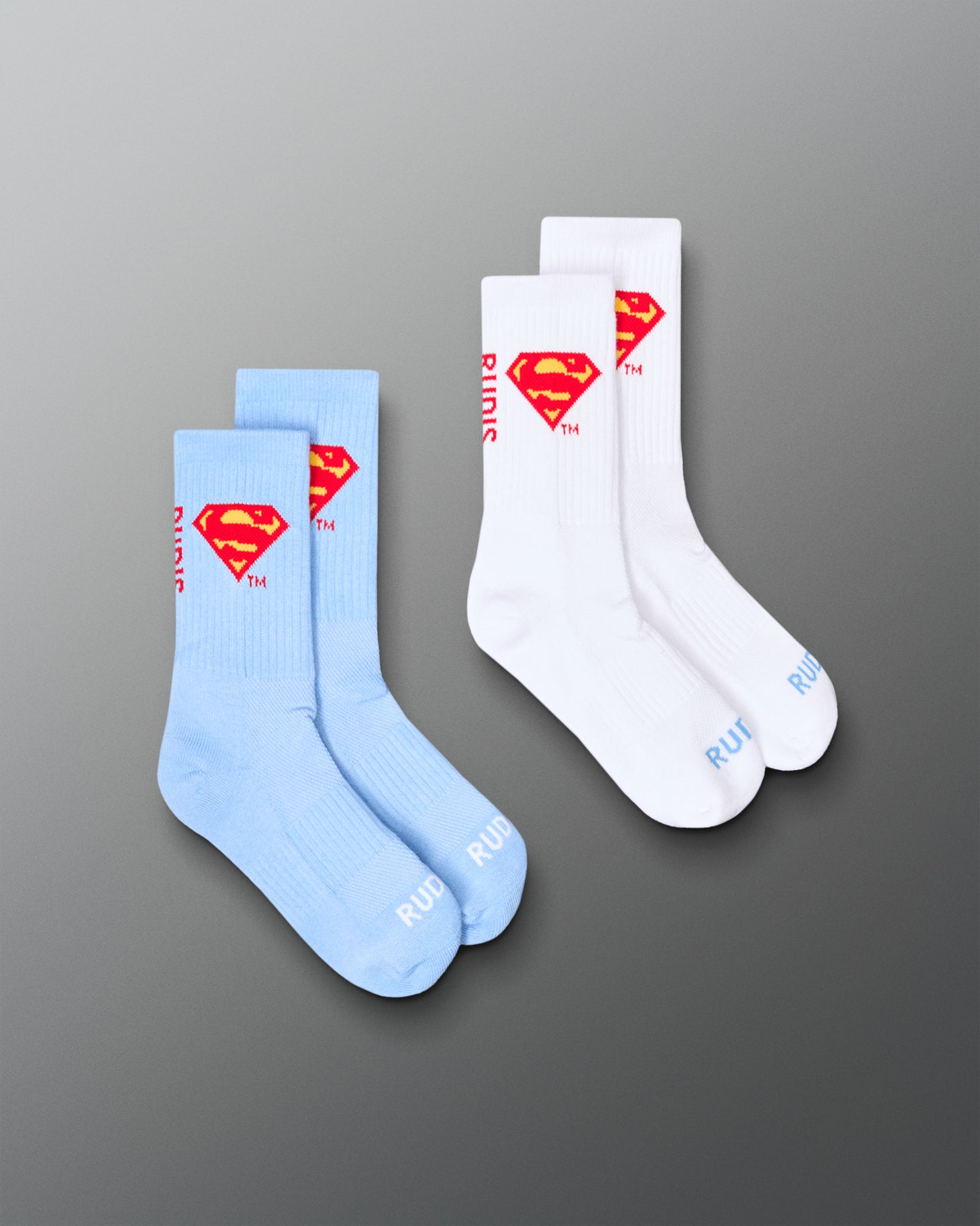 RUDIS Superman Cushion Crew Socks two-pack in white and blue, featuring the red and yellow Superman shield logo.