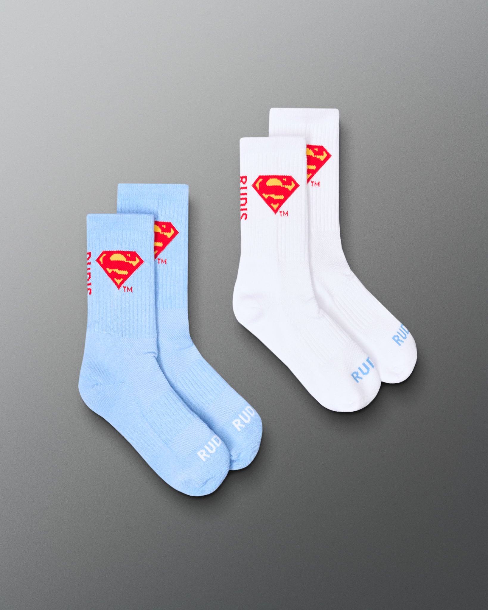 RUDIS Superman Cushion Crew Socks two-pack in white and blue, featuring the red and yellow Superman shield logo.