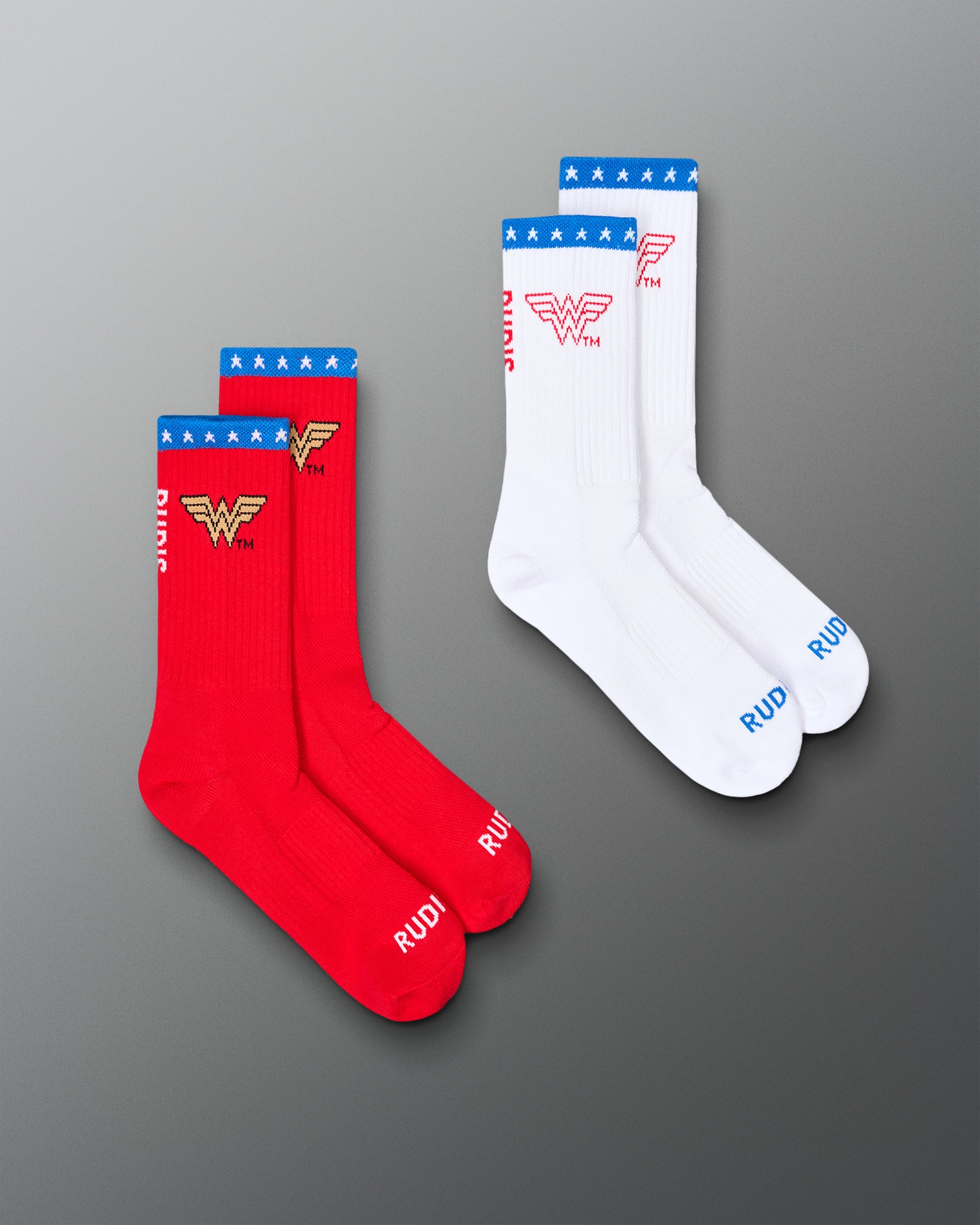 RUDIS Wonder Woman cushioned crew socks 2-pack in red and white, featuring Wonder Woman logos, blue star-patterned cuffs, and RUDIS branding.
 Copy Alt Text