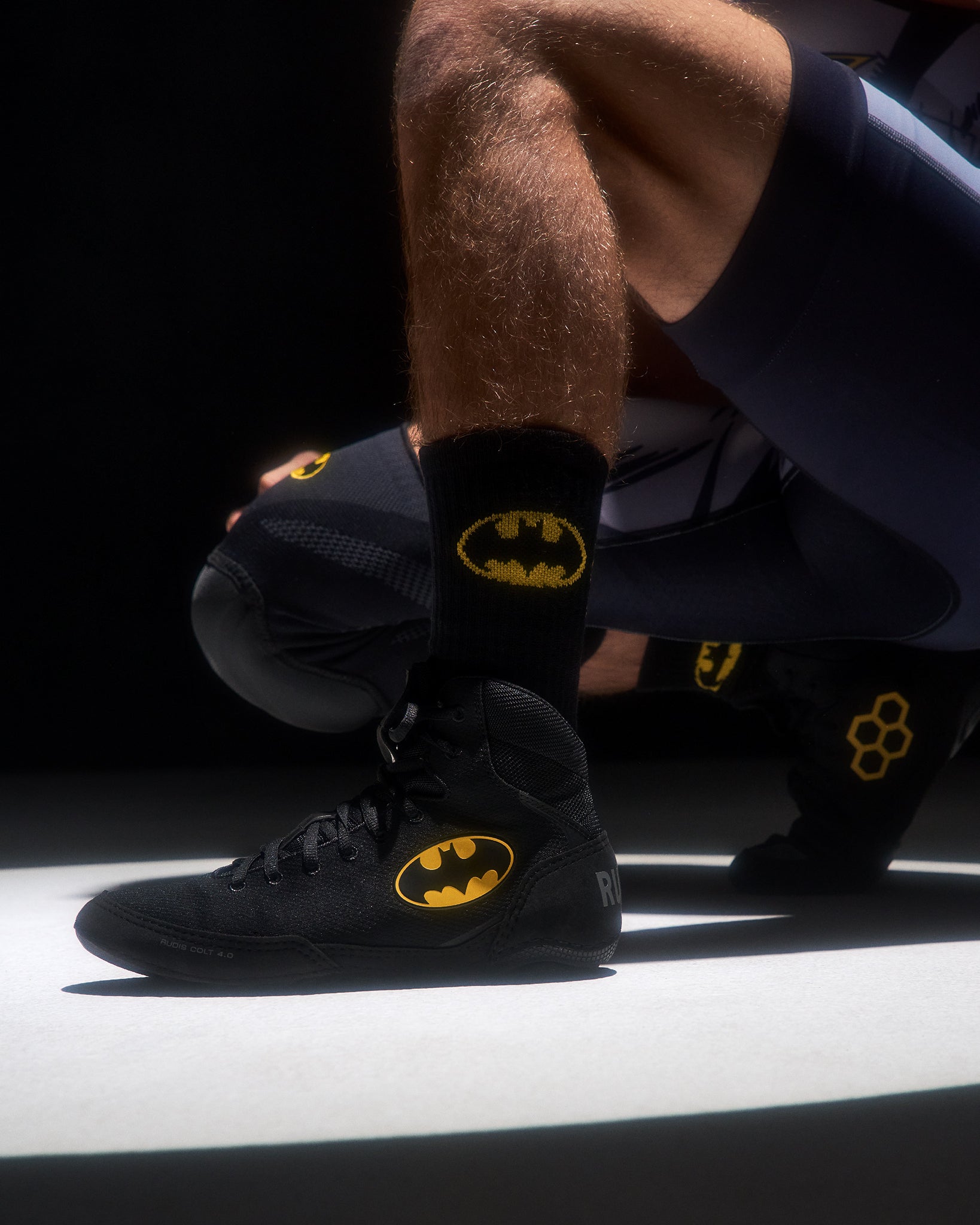 RUDIS Batman Cushion Crew Sock worn with a black Batman wrestling shoe, featuring the yellow Batman logo.