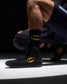 RUDIS Batman Cushion Crew Sock worn with a black Batman wrestling shoe, featuring the yellow Batman logo.