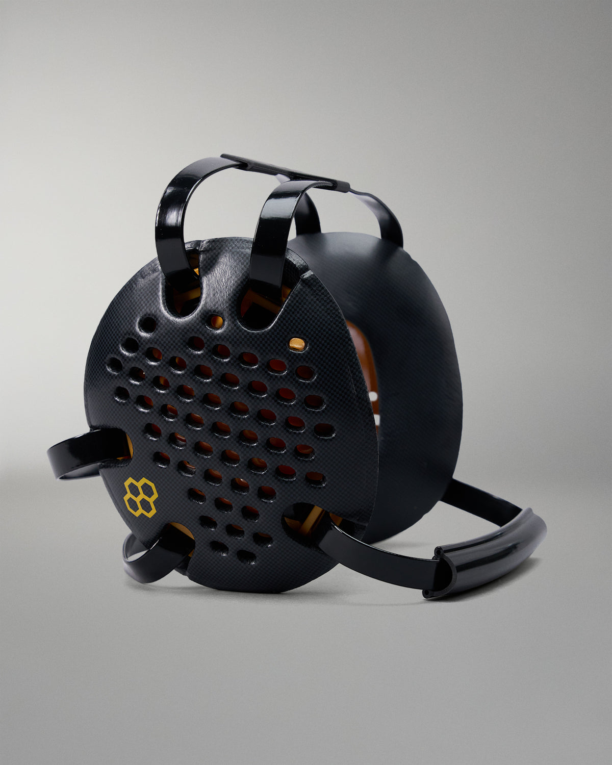 Black metal reel with handle on a gray background