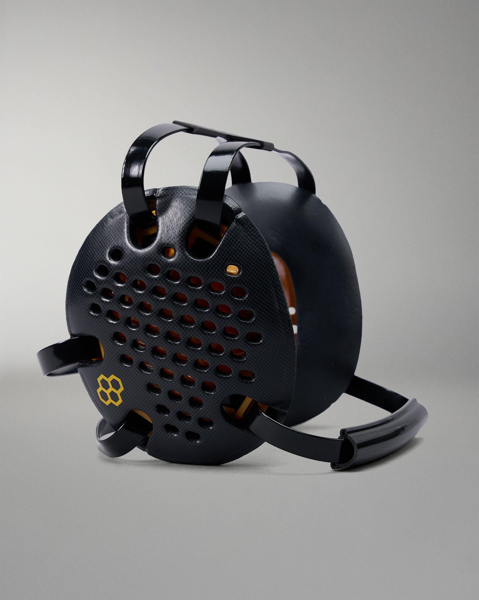 Black metal reel with handle on a gray background