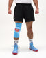 Front view of wrestler wearing the blue RUDIS Superman Cushion Kneepad with padded Superman shield over the knee.