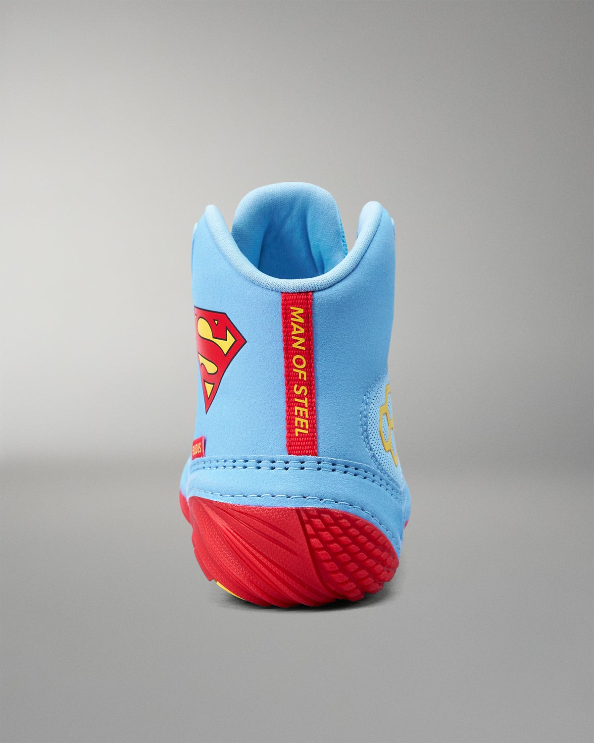 Rear view of RUDIS JB1 Superman wrestling shoe with red Man of Steel heel tab and Superman branding.
