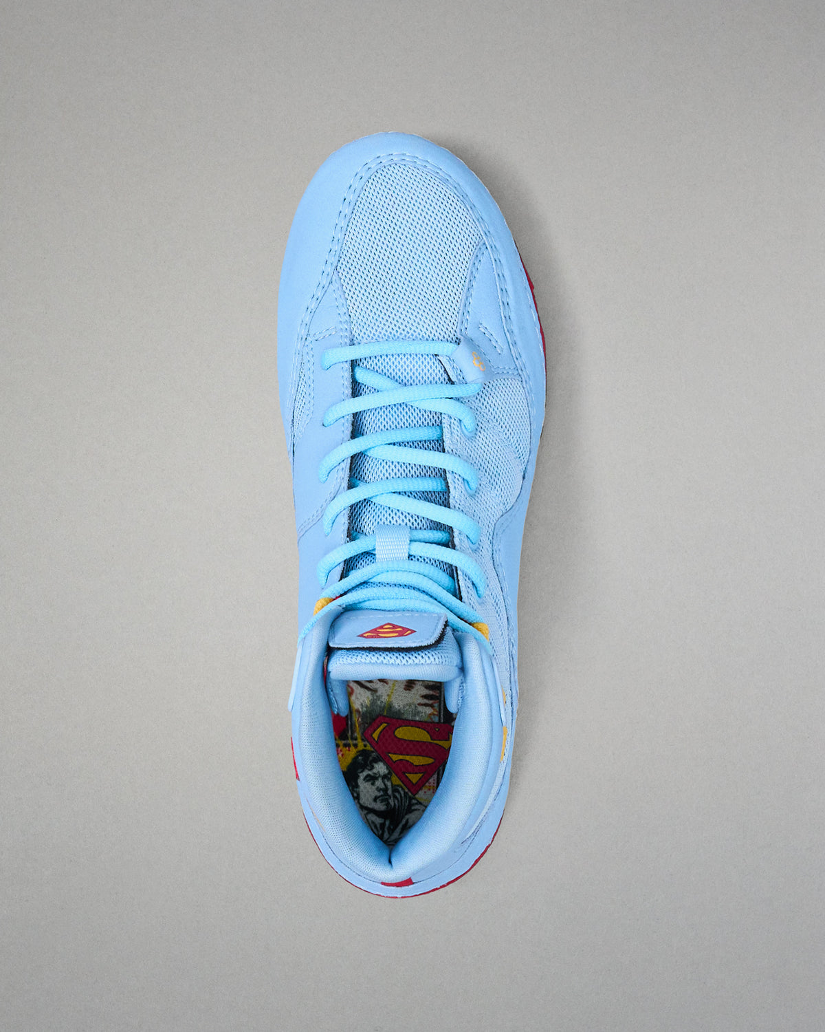 Top view of RUDIS JB1 Superman wrestling shoe showing light blue laces, mesh upper and Superman graphic footbed.