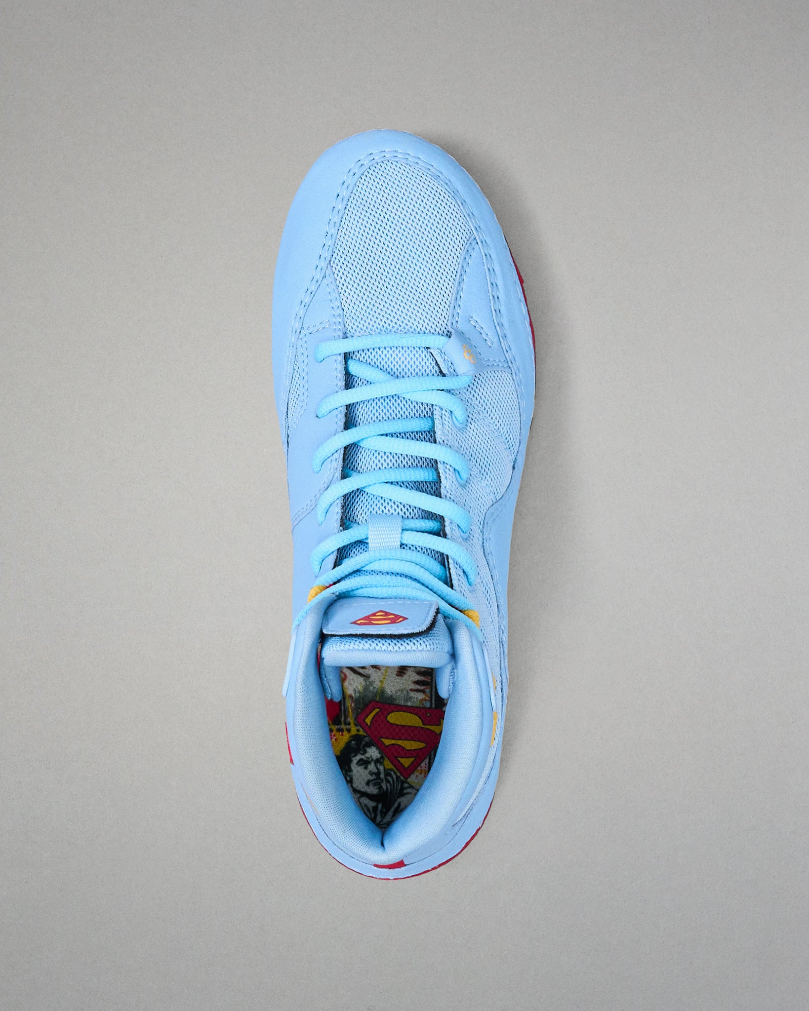 Top view of RUDIS JB1 Superman wrestling shoe showing light blue laces, mesh upper and Superman graphic footbed.
