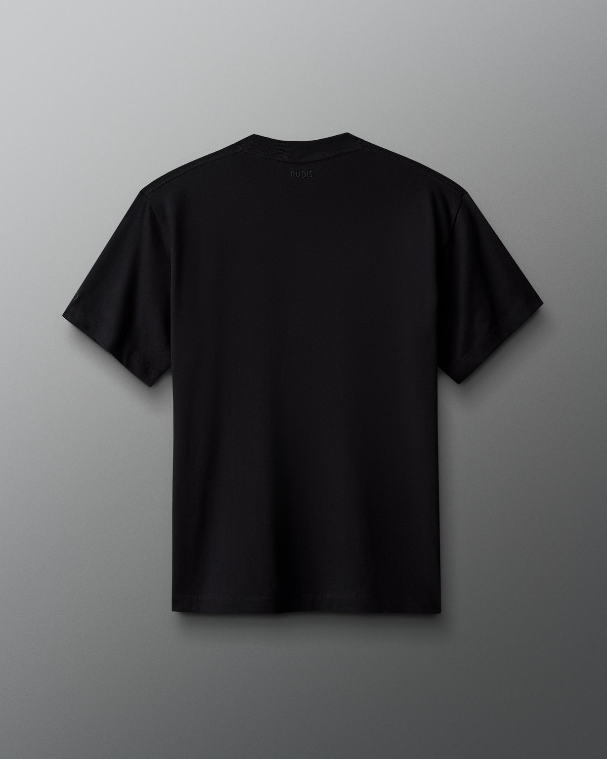 Back view of the RUDIS Scooby-Doo Relaxed Cotton T-Shirt in black, featuring a clean, solid-color design, short sleeves, crew neckline, and subtle RUDIS branding below the back collar.