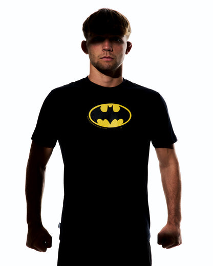 Male athlete wearing the black RUDIS Batman Icon Elite Super Soft T-Shirt featuring the classic yellow Batman logo on the chest.